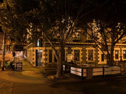 Photo of the exterior of the Grace Darling Hotel at night
