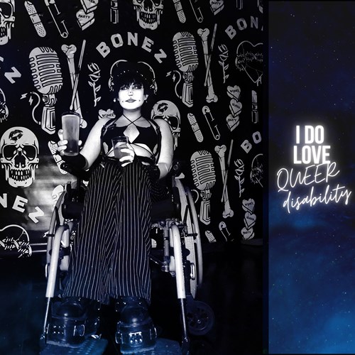 I DO LOVE QUEER disability poster with a person in wheelchair and image of microphones and BONEZ behind