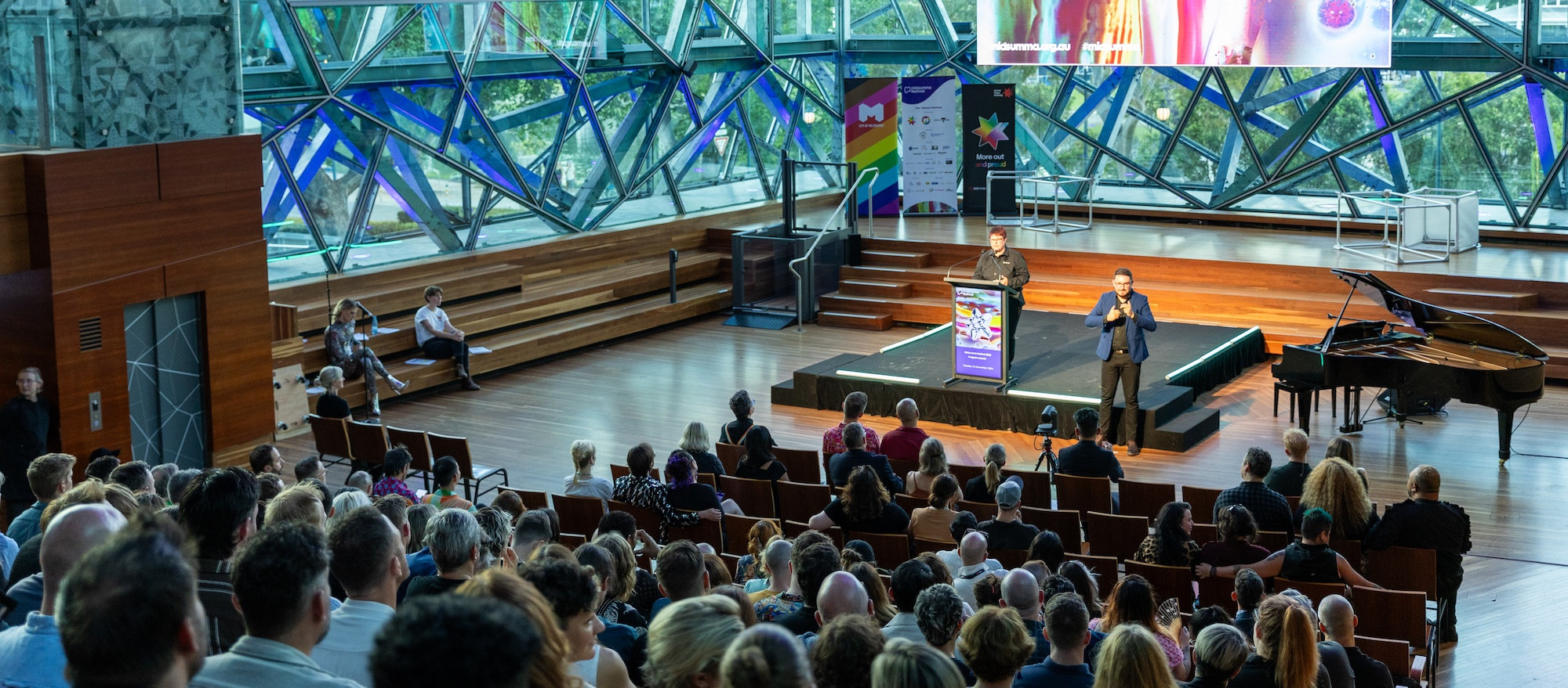 The Edge at Fed Square during the Midsumma Festival 2025 Program Launch showing a speaker and the audience