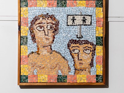Ceramic mosaic of two human figures - similar to what one might find at Pompeii